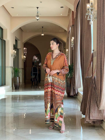 TFC Baysafar Our statement prints, color play and thematic details embodying the true spirit of the TFC. Crepe Silk non sheer premium fabric with embellished neckline of pearls, dabka, kora and cut dana.