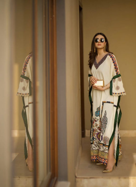 TFC Caftan Our statement prints, color play and thematic details embodying the true spirit of the TFC. Crepe Silk non sheer premium fabric with embellished neckline of pearls and cut dana.
